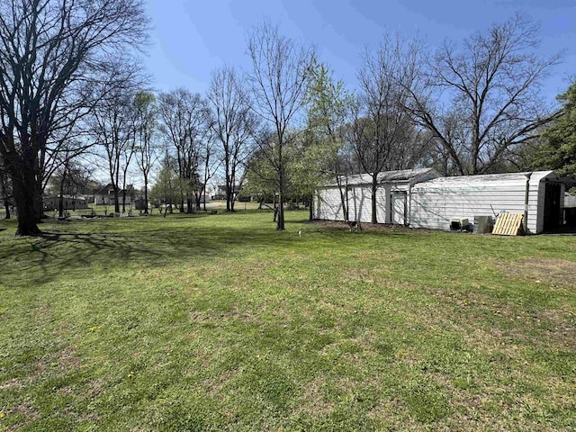 417 E Tigrett St, Halls, TN 38040 - view of yard featuring an outbuilding