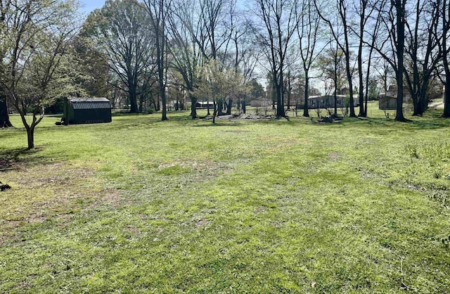 417 E Tigrett St, Halls, TN 38040 - view of yard with an outbuilding and a storage shed