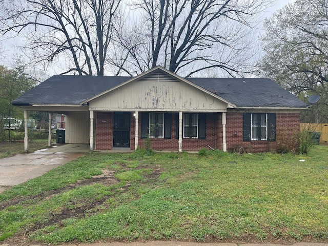 3497 Steele St, Memphis, TN 38127 - ranch-style house with brick siding, driveway, a carport, and a porch