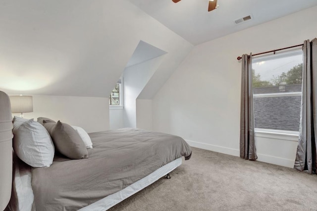 bedroom with visible vents, carpet, baseboards, a ceiling fan, and vaulted ceiling