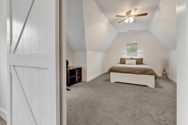 bedroom with a ceiling fan, carpet floors, baseboards, and lofted ceiling
