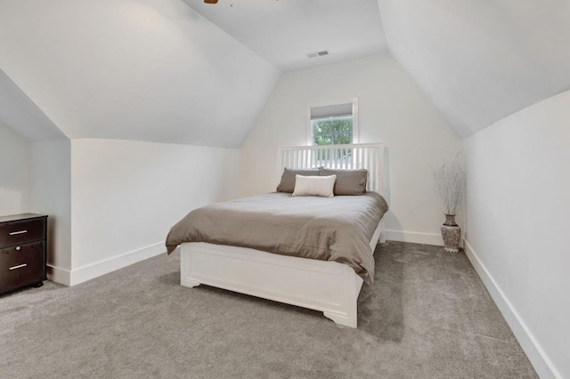 bedroom featuring carpet flooring, a ceiling fan, lofted ceiling, baseboards, and visible vents