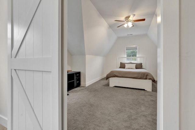 bedroom featuring carpet flooring, a ceiling fan, baseboards, and lofted ceiling