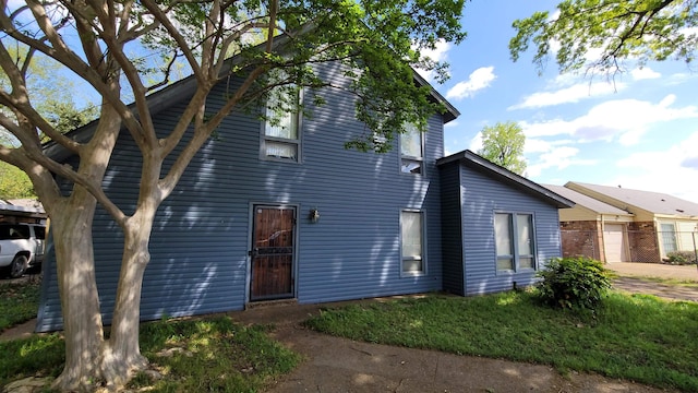 exterior space with driveway and fence