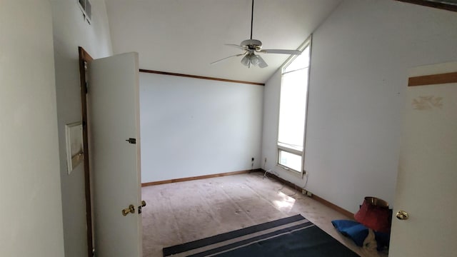 unfurnished room featuring ceiling fan, baseboards, and lofted ceiling