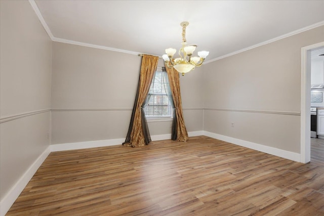 unfurnished room with a notable chandelier, crown molding, and light wood finished floors
