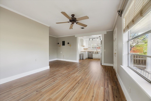 unfurnished living room featuring baseboards, crown molding, and light wood finished floors