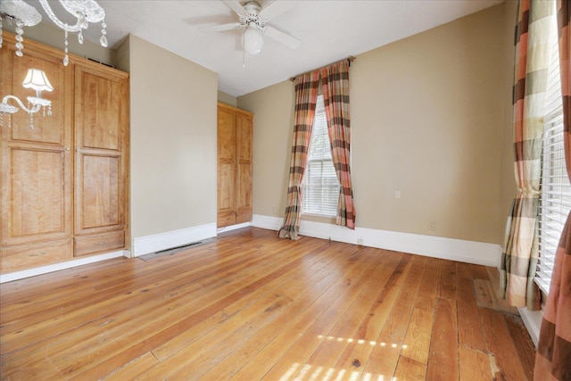 interior space with baseboards and light wood-style floors