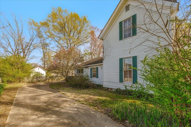 view of property exterior with driveway