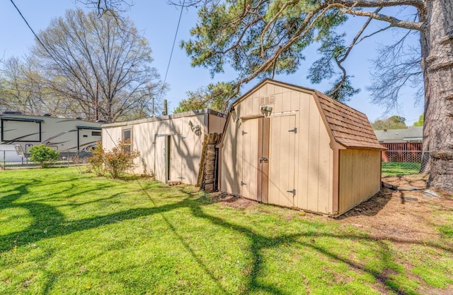view of shed with fence