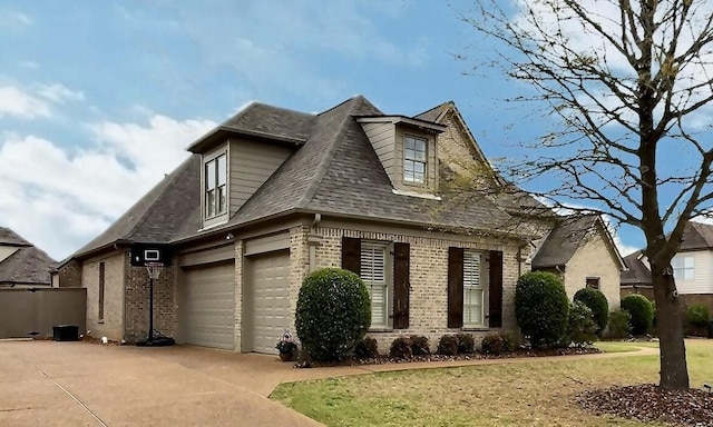 1700 Cypress Springs Ln, Collierville, TN 38017 - view of front facade featuring brick siding, concrete driveway, a garage, roof with shingles, and a front lawn