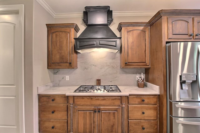 1700 Cypress Springs Ln, Collierville, TN 38017 - kitchen with stainless steel appliances, custom range hood, light countertops, backsplash, and ornamental molding