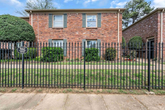 5878 Roxbury Dr Unit 5878, Memphis, TN 38119 - view of home's exterior with brick siding and a fenced front yard