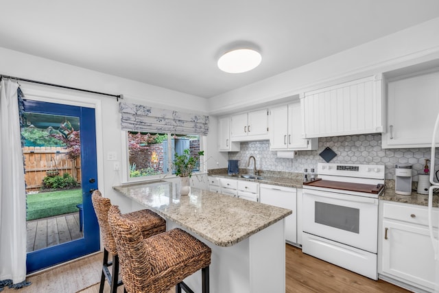5878 Roxbury Dr Unit 5878, Memphis, TN 38119 - kitchen featuring white cabinets, a sink, light stone counters, and white appliances