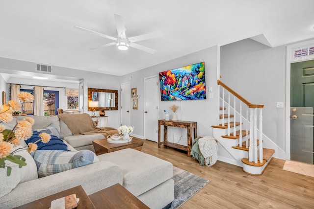 5878 Roxbury Dr Unit 5878, Memphis, TN 38119 - living area featuring stairway, a ceiling fan, wood finished floors, baseboards, and visible vents