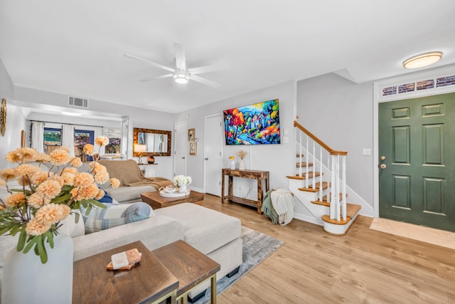 5878 Roxbury Dr Unit 5878, Memphis, TN 38119 - living area featuring stairs, baseboards, light wood-style floors, visible vents, and a ceiling fan