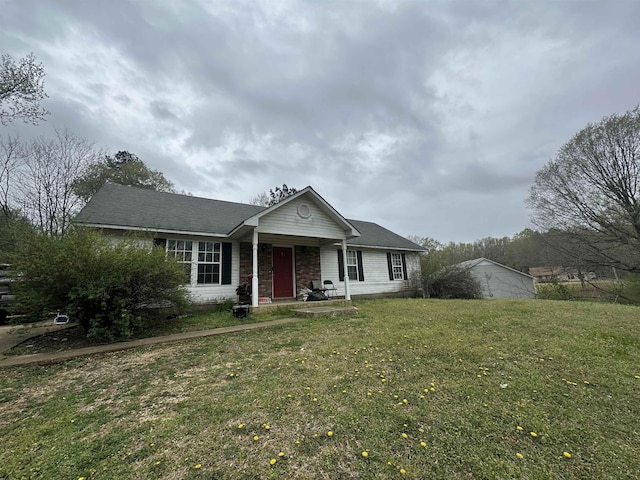 380 Summit Dr, Bolivar, TN 38008 - bungalow featuring stone siding, a front yard, and a shingled roof