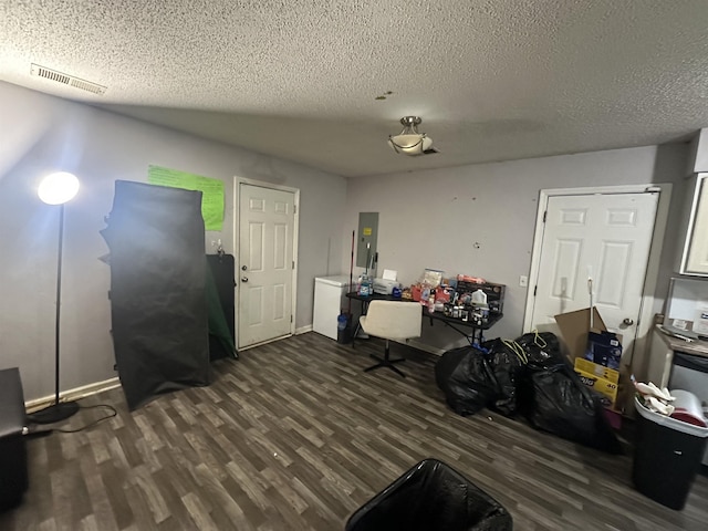 380 Summit Dr, Bolivar, TN 38008 - interior space featuring electric panel, dark wood-style floors, visible vents, and a textured ceiling