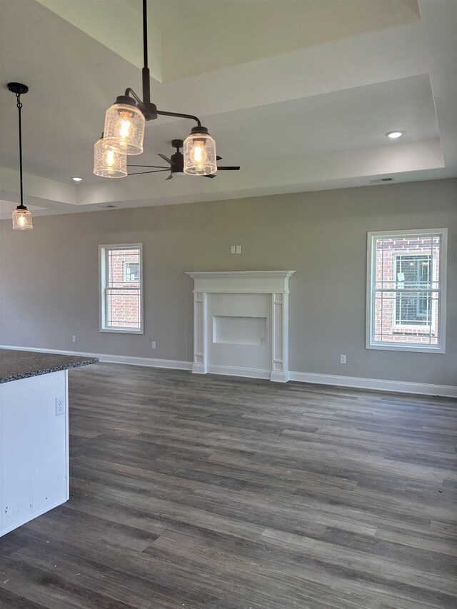 9742 Ryder Springs Dr, Cordova, TN 38018 - unfurnished living room with a raised ceiling, ceiling fan, baseboards, dark wood finished floors, and recessed lighting