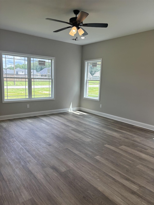 9742 Ryder Springs Dr, Cordova, TN 38018 - unfurnished room with dark wood-type flooring, baseboards, and a ceiling fan