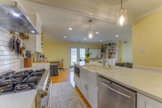 26 N Ashlawn Dr, Memphis, TN 38112 - kitchen featuring a sink, range hood, dishwasher, stove, and ornamental molding