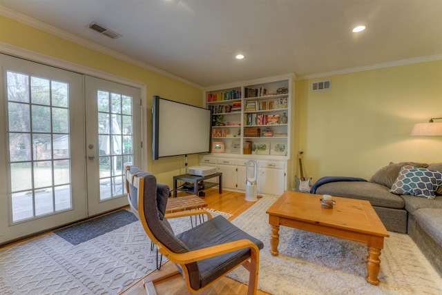 26 N Ashlawn Dr, Memphis, TN 38112 - living area featuring visible vents, crown molding, wood finished floors, and french doors
