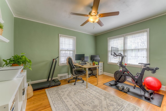 26 N Ashlawn Dr, Memphis, TN 38112 - exercise area with visible vents, ornamental molding, ceiling fan, and light wood-type flooring