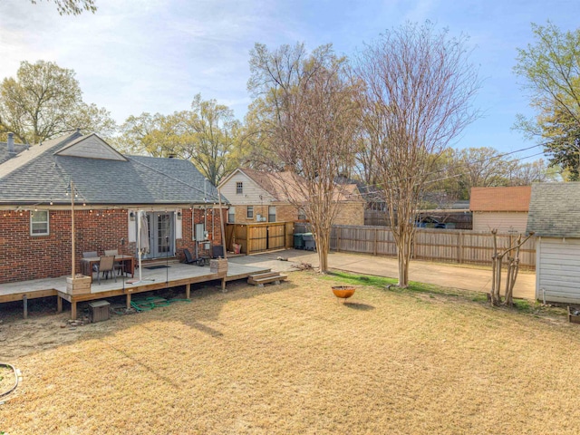 26 N Ashlawn Dr, Memphis, TN 38112 - view of yard featuring a wooden deck, a fenced backyard, and french doors