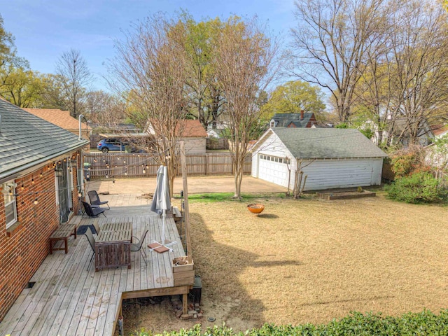 26 N Ashlawn Dr, Memphis, TN 38112 - view of yard with a garage, fence, a wooden deck, and an outbuilding