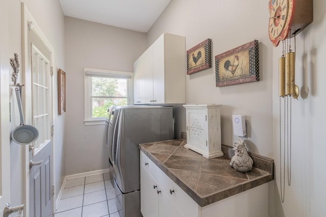 1249 Mintmere Dr, Collierville, TN 38017 - laundry room with cabinet space and light tile patterned floors