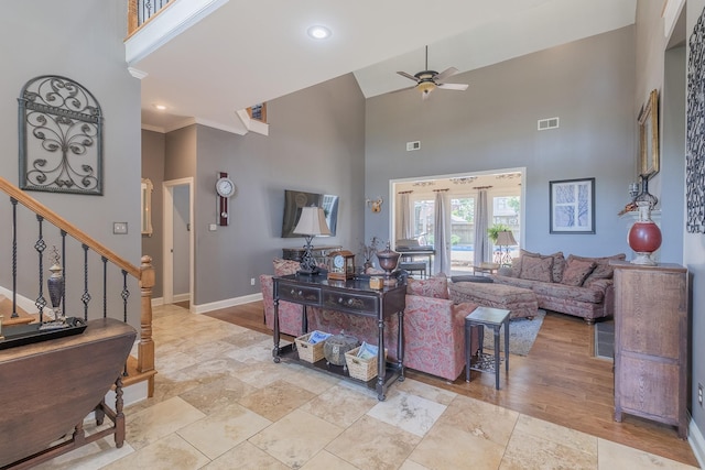 1249 Mintmere Dr, Collierville, TN 38017 - living room featuring a ceiling fan, a high ceiling, stairs, stone finish floors, and recessed lighting
