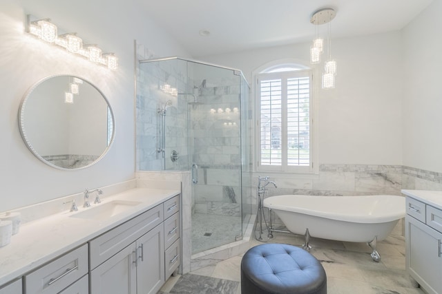 1249 Mintmere Dr, Collierville, TN 38017 - bathroom with vanity, a soaking tub, a stall shower, marble finish flooring, and wainscoting