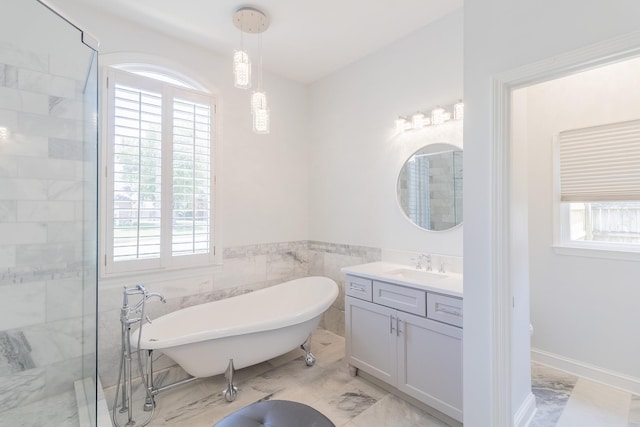 1249 Mintmere Dr, Collierville, TN 38017 - bathroom featuring a soaking tub, vanity, healthy amount of natural light, and marble finish floors