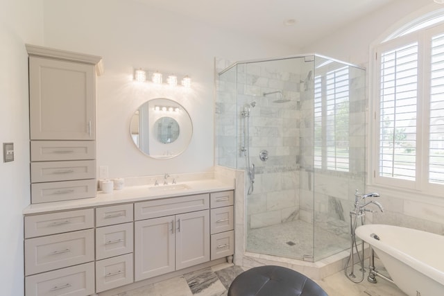 1249 Mintmere Dr, Collierville, TN 38017 - full bath featuring a stall shower, plenty of natural light, a freestanding tub, and vanity