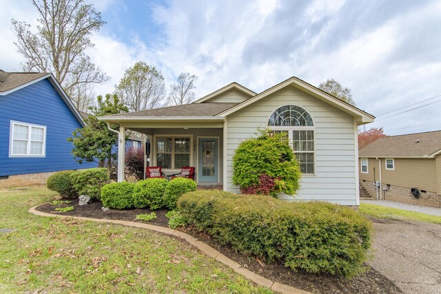 145 Ping Hill Cv, Counce, TN 38326 - view of front of home with a porch and roof with shingles