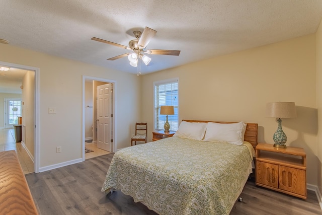 145 Ping Hill Cv, Counce, TN 38326 - bedroom with baseboards, multiple windows, and wood finished floors