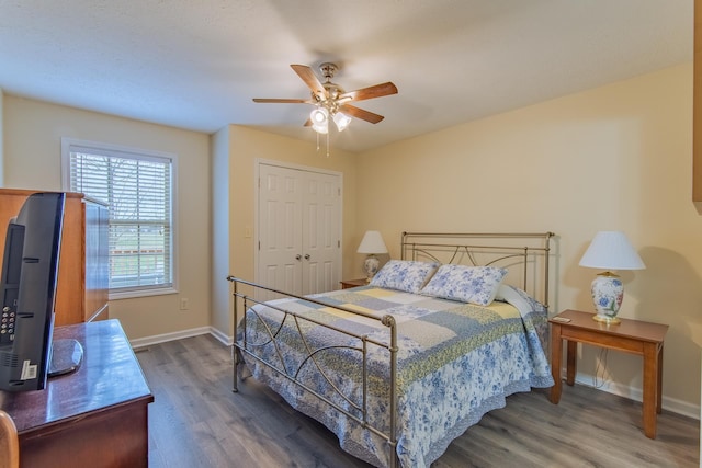 145 Ping Hill Cv, Counce, TN 38326 - bedroom featuring a closet, baseboards, ceiling fan, and wood finished floors