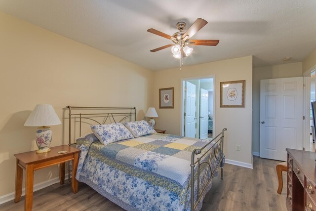 145 Ping Hill Cv, Counce, TN 38326 - bedroom featuring baseboards, ceiling fan, and wood finished floors