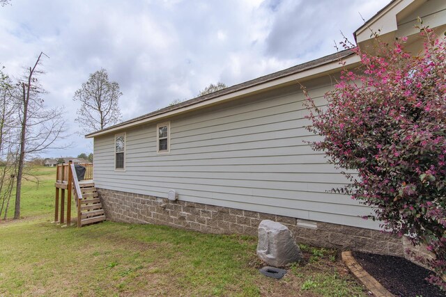 145 Ping Hill Cv, Counce, TN 38326 - view of side of home with a lawn and stairs