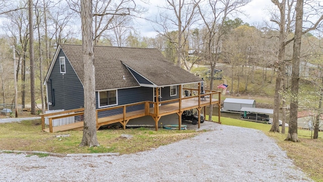 1085 Yellow Creek Ln, Counce, TN 38326 - view of front of property with gravel driveway, a deck, and roof with shingles