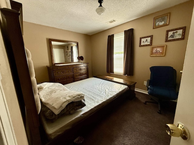 614 Estridge Cv, Memphis, TN 38122 - bedroom featuring carpet, visible vents, baseboards, and a textured ceiling