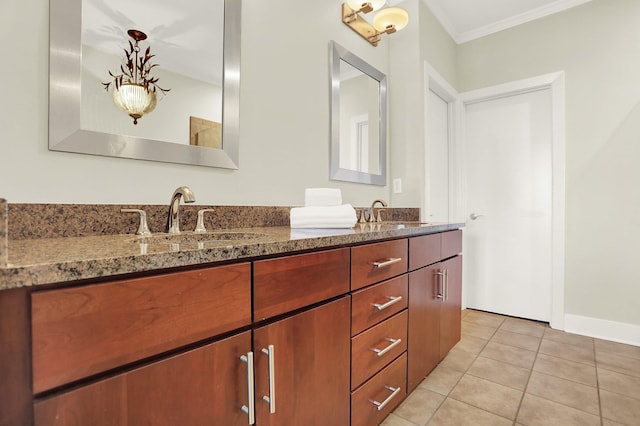 358 N Island Dr Unit 105, Memphis, TN 38103 - bathroom featuring double vanity, a sink, tile patterned floors, and crown molding
