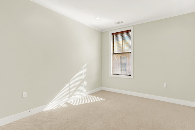 358 N Island Dr Unit 105, Memphis, TN 38103 - unfurnished room featuring baseboards, ornamental molding, visible vents, and light carpet