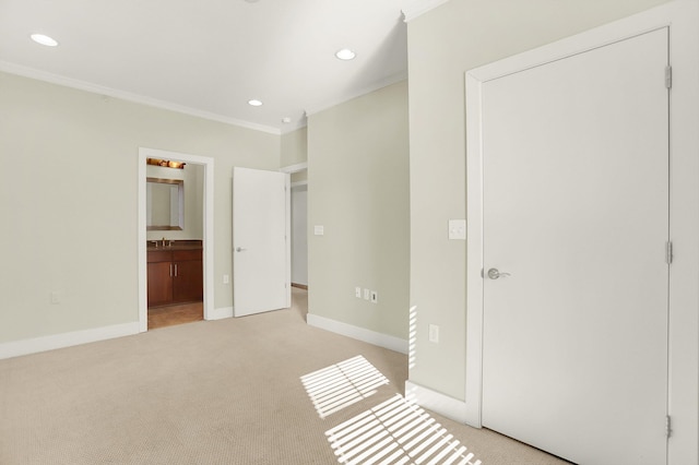 358 N Island Dr Unit 105, Memphis, TN 38103 - unfurnished bedroom featuring light colored carpet, recessed lighting, crown molding, and baseboards