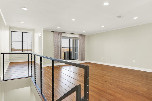 358 N Island Dr Unit 105, Memphis, TN 38103 - interior space with an upstairs landing, wood finished floors, baseboards, visible vents, and recessed lighting
