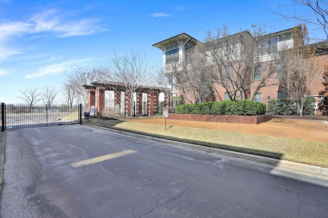 358 N Island Dr Unit 105, Memphis, TN 38103 - view of road with a gated entry, a gate, and curbs