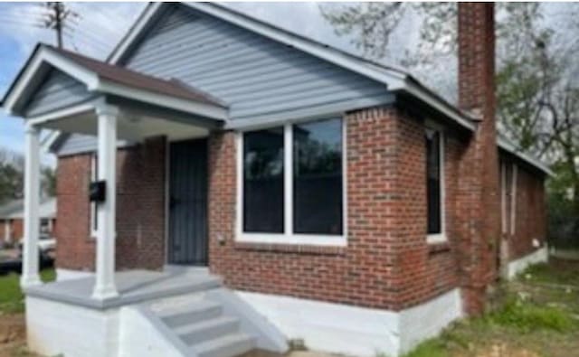 1318 Breedlove St, Memphis, TN 38107 - view of front of property featuring a chimney and brick siding