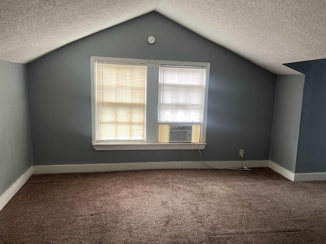 bonus room featuring cooling unit, a textured ceiling, vaulted ceiling, and carpet floors