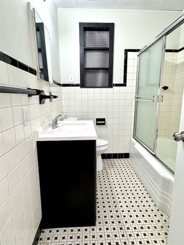 1280 Salem St, Memphis, TN 38122 - full bath featuring vanity, enclosed tub / shower combo, tile patterned flooring, toilet, and tile walls