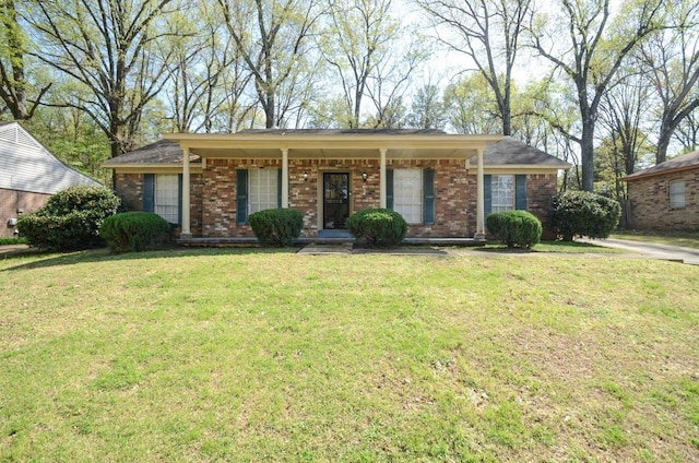 ranch-style home with a front lawn and brick siding